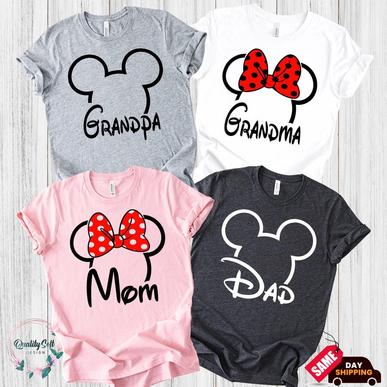 four t-shirts with the Disney character Mickey Mouse ears and the text "Grandpa", "Grandma", "Mom", and "Dad" printed on them, suggesting they are family-themed shirts.