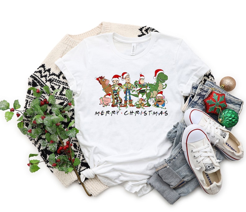 a white t - shirt with the words merry christmas on it