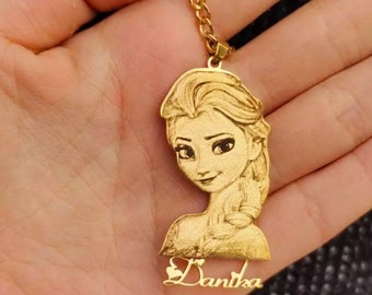 May include: Gold-tone necklace with a pendant featuring a detailed image of a cartoon princess with blonde hair. The pendant also includes the name "Danika" with a heart symbol.