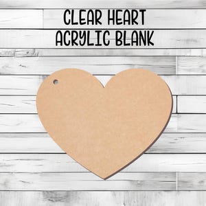 May include: A clear heart-shaped acrylic blank, perfect for crafting and personalization. The blank is made of clear acrylic and has a smooth, polished finish.
