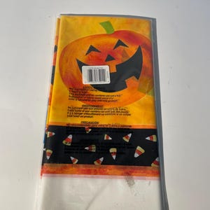 Halloween Party Plastic Tablecover: Candy Corn & Pumpkins (54 x 108 Inches)