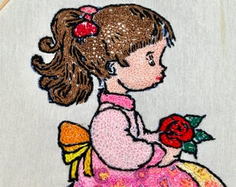 Vintage hand-sewn crewel needlepoint picture of a girl - embroidery hoop frame, flowers, spring, nature, stitchery, pink