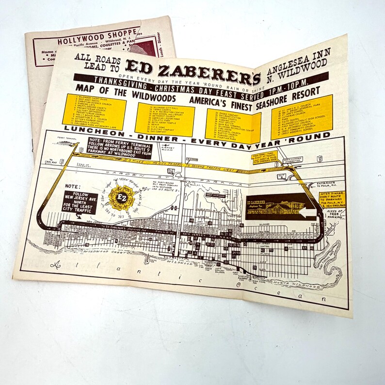 May include: Vintage map of Wildwood, New Jersey, featuring a detailed street layout and local businesses. The map includes the text "Ed Zaberer's" and "Anglesea Inn." The map is folded and has a cream and yellow color scheme.