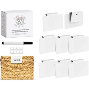 May include: A set of eight white metal clip-on labels with a black marker and a sheet of adhesive dots. The labels are blank and can be used to organize items in the home or office. The labels are packaged in a white box with the text "Apple Pie Order" and "Organizing solutions to make your life a little bit sweeter" printed on it. The box also includes the text "8 Metal Clip-On Labels".