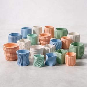 May include: A collection of small, decorative plant pots in various pastel colours including blue, green, peach, and white. The pots feature diverse textures such as vertical ribs, wavy patterns, geometric grids, and smooth, twisted, or square shapes.