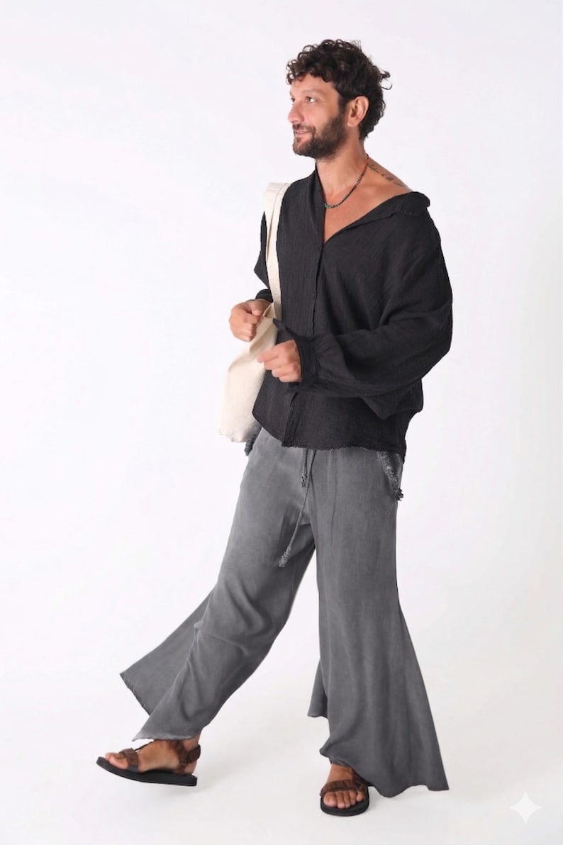 Front view of a man wearing an oversized midnight black linen shirt with a relaxed collar.