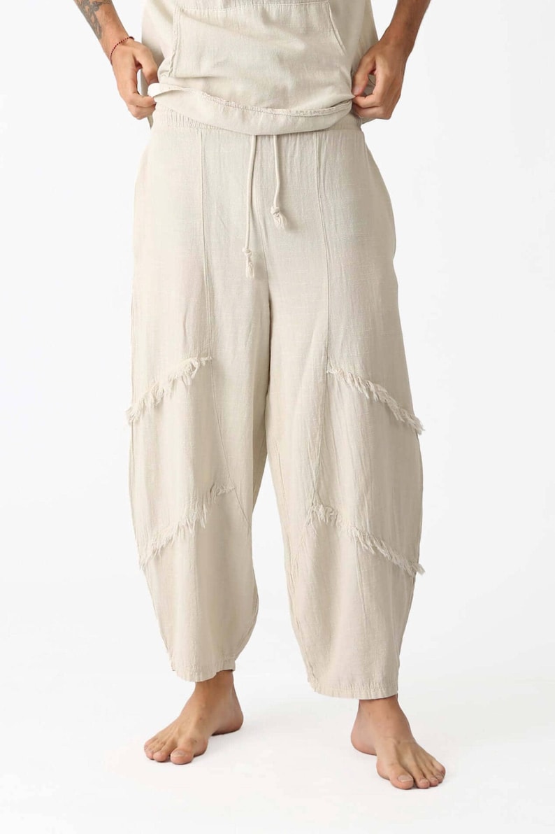 Handmade linen palazzo pants in cream with a drawstring waist and diagonal frayed panels for boho, breathable yoga/meditation style.