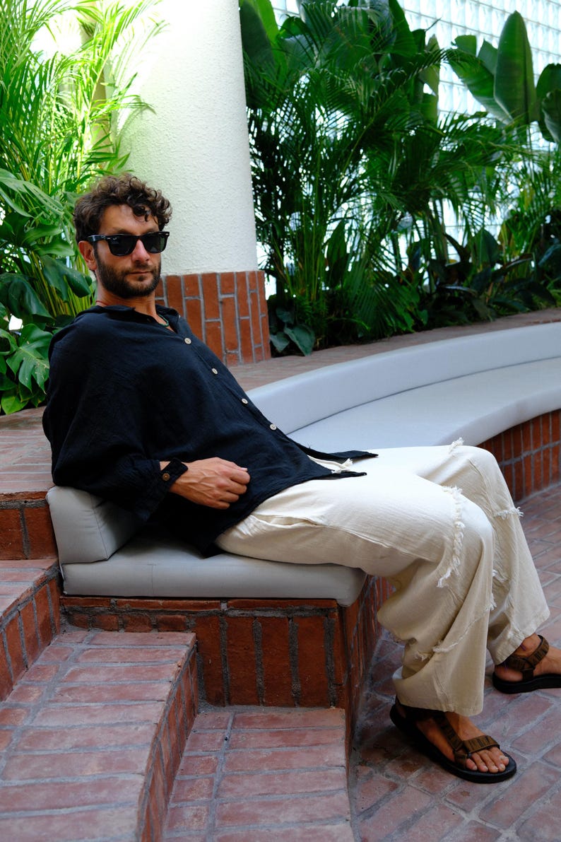 Sustainable black handmade longsleeve shirt used as a versatile daily essential.