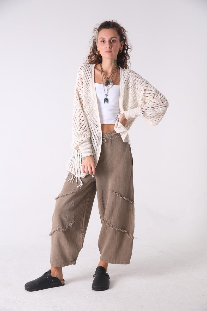 Handmade brown linen palazzo pants by Snug Brandwear on a model in a cream cardigan; boho harem-style yoga trousers.