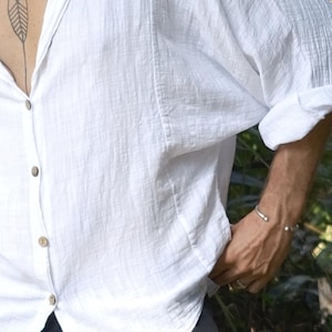 White batwing linen shirt, oversized relaxed-fit boho top with rolled sleeves and button-up front.