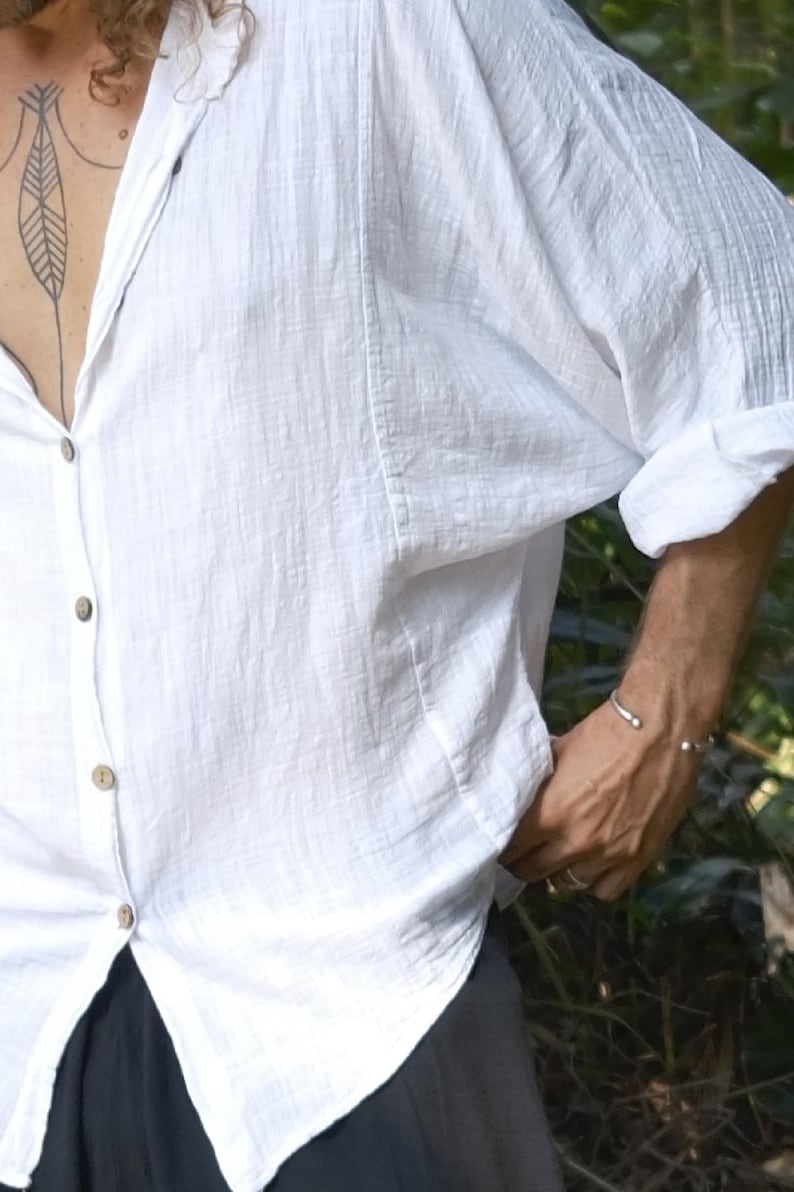 White batwing linen shirt, oversized relaxed-fit boho top with rolled sleeves and button-up front.