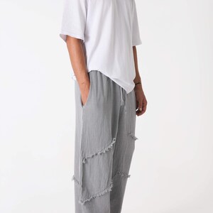Handmade linen palazzo pants in light gray with frayed patch panels; boho yoga trousers by Snug Brandwear.