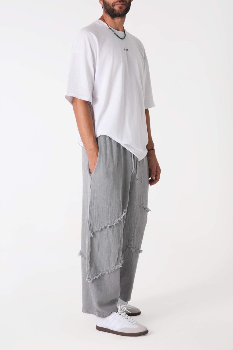 Handmade linen palazzo pants in light gray with frayed patch panels; boho yoga trousers by Snug Brandwear.