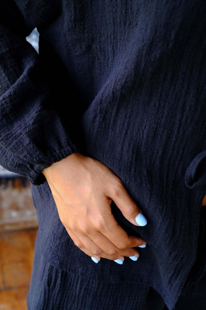 Close-up of Night Long Sleeve Cardigan elasticated wrist cuff and deep navy cotton gauze texture — highlighting the soft breathable fabric quality and relaxed semi baloon sleeve detail