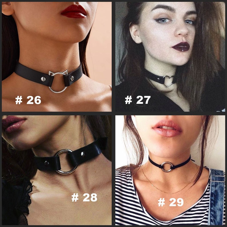 May include: A collection of four chokers. The chokers are black with silver-tone metal accents. Designs include a cat-ear shape, a heart, a large ring, and a small ring. Each choker has a number in white text.