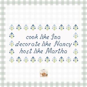 May include: A white cross-stitch pattern featuring the text "cook like Ina, decorate like Nancy, host like Martha" in dark blue, surrounded by a border of small light blue and green floral motifs, framed by a light green and white gingham border.