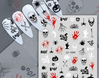 May include: A sheet of Halloween nail stickers with a variety of designs, including skulls, spiders, pumpkins, and the words "Trick or Treat!" and "Boo!" The stickers are on a white background.