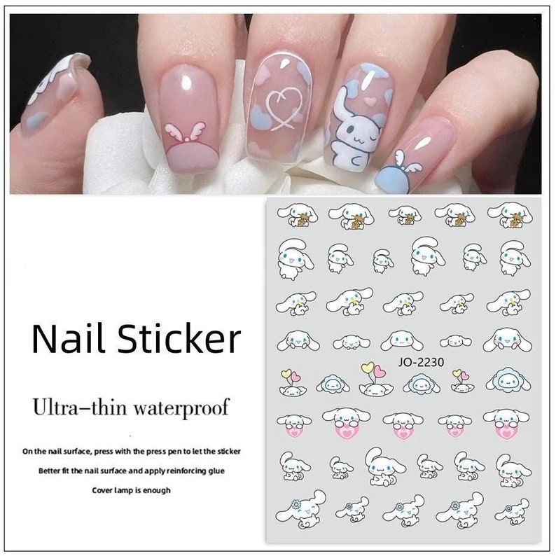 Op de afbeelding: Een vel witte nagelstickers met een lichtblauw en roze cartoon-hondendesign. De stickers zijn gerangschikt in rijen en kolommen. De tekst "JO-2230" is op het vel gedrukt.
