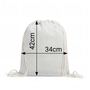 May include: A plain white drawstring backpack made of fabric. The bag features integrated white cord straps for closure. Black dimension lines and arrows indicate a height of 42cm and a width of 34cm printed directly on the front surface.