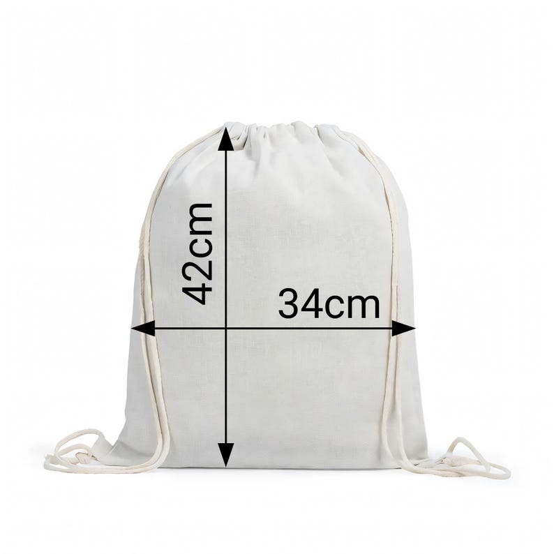 May include: A plain white drawstring backpack made of fabric. The bag features integrated white cord straps for closure. Black dimension lines and arrows indicate a height of 42cm and a width of 34cm printed directly on the front surface.