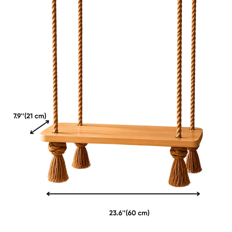 May include: A rectangular light brown wooden floating shelf suspended by four thick twisted tan ropes. The shelf features decorative tan tassels tied at each corner. The dimensions are 21 cm in depth and 60 cm in width.