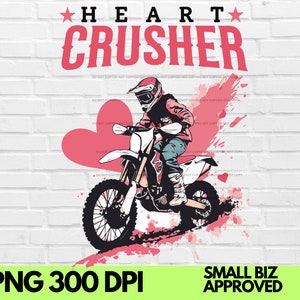 May include: A pink heart with a white outline and the text "HEART CRUSHER" in red letters. A person wearing a red and white motocross helmet and riding a dirt bike with a pink heart design. The background is a white brick wall.