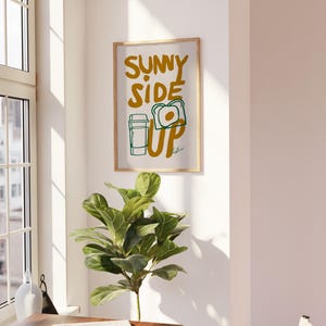 breakfast wall art, funny kitchen poster, egg toast illustration, coffee print, sunny side up wall art, retro breakfast poster, quirky food wall decor, positive quote poster, kitchen art, morning print, food quote poster, vintage print, aesthetic wall art, cafe decor print, modern kitchen wall art, cozy home print, foodie gift idea, uplifting breakfast art, modern kitchen print, inspirational quote, morning routine poster, minimalist kitchen decor, funky wall art, bold food illustration