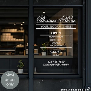May include: A white vinyl window decal featuring the text Business Name, YOUR SLOGAN IS HERE, OPEN, MONDAY-FRIDAY 9:00 AM - 9:00 PM, SATURDAY 10:00 AM - 9:00 PM, CLOSE SUNDAY, 123-456-7890, and www.yourwebsite.com in a clean, professional font style.
