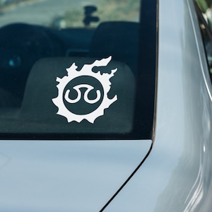 May include: A white vinyl sticker of the Final Fantasy VII logo on a silver car.