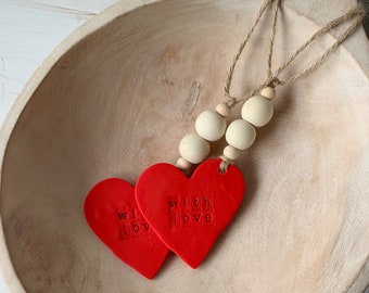 Gift Tags with Natural Wood Beads & Jute Twine. Set of 2. Red Heart Primitive Clay Tags stamped “WITH LOVE.” Handshaped. Handmade Tag.