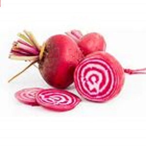 May include: Close-up of red beets with white stripes, sliced and whole, showing the vibrant color and texture of the root vegetable.