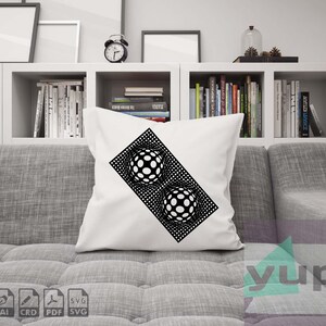 May include: A white throw pillow with a black and white geometric design of two spheres. The design is on a diagonal and the spheres are made up of circles.