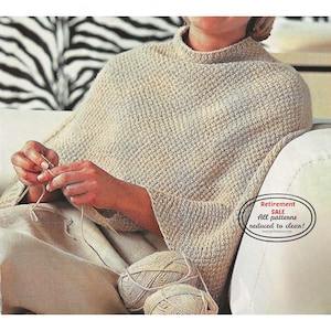 May include: A beige knitted poncho with a high collar. The person is knitting with beige yarn and needles. Two balls of yarn are visible. The image includes a text that says "Retirement SALE All patterns reduced to clean!"