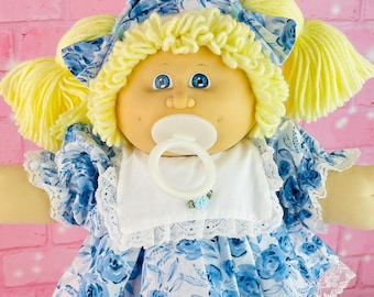 Vintage 1986 Cabbage Patch Kid Doll: Blonde Hair, Blue Floral Dress, Pacifier Girl