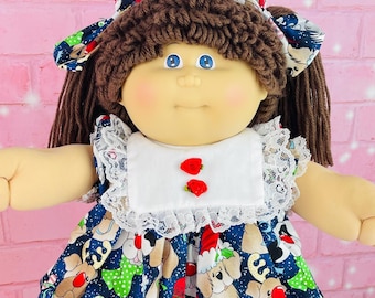 1985 Cabbage Patch Kid Doll: IC2 Factory, Brown Hair, Puppy Dress