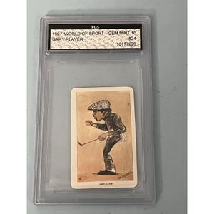 May include: A vintage trading card featuring a cartoon illustration of golfer Gary Player. The card is graded GEM MINT 10 by FGS and has the number 24 printed on it.