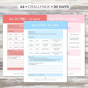 Peut inclure: Feuilles d'exercices d'apprentissage de la langue coréenne. La feuille supérieure est rose et porte le texte "Day 15: 자다 ~ to sleep." La feuille du milieu est bleue avec le texte "Day 2: 오다 ~ to come." Le haut de l'image indique "A4 • CHALLENGE • 30 DAYS."