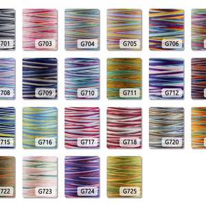 May include: A collection of 25 spools of colorful embroidery floss. Each spool is labeled with a number, starting with G701 and ending with G725.