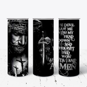 May include: Three black and white sublimation tumblers with a religious theme. The first tumbler features a close-up of Jesus with a crown of thorns. The second tumbler features Jesus holding a sword. The third tumbler features a quote: "The devil saw me with my head down and thought he'd won until I said Amen."