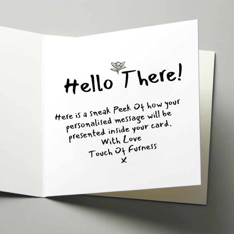 May include: A white greeting card with the text "Hello There!" in a handwritten style. The card's interior reveals a message about a personalized message. The card is open, showing the inside text.