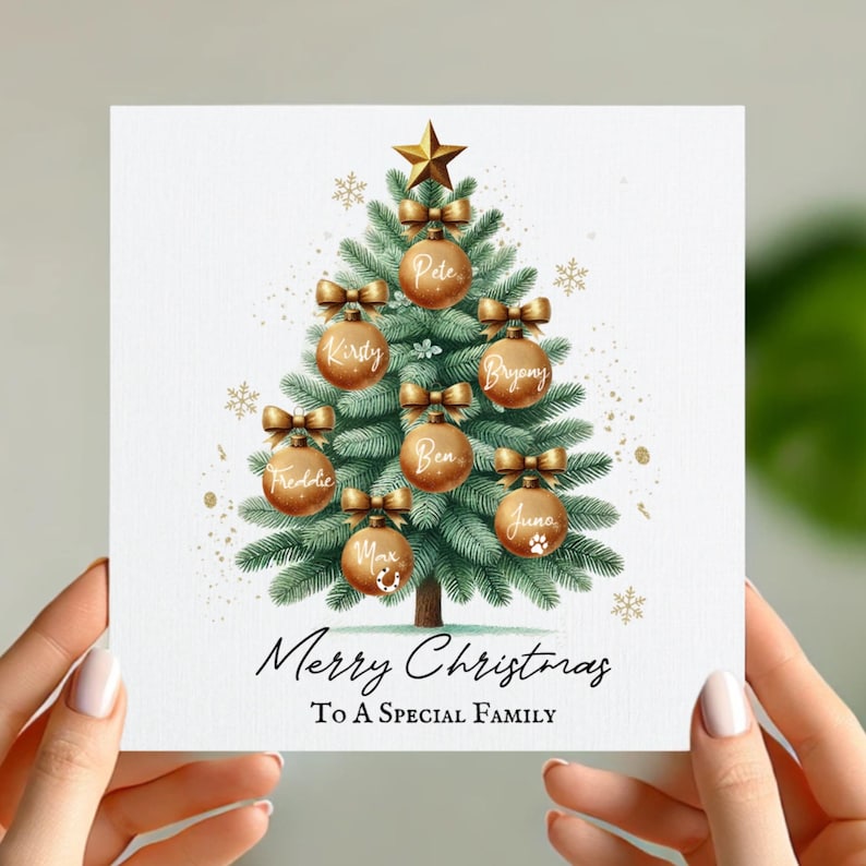 May include: A Christmas card with a green Christmas tree decorated with gold ornaments and bows. Each ornament has a name written on it, including Pete, Kirsty, Bryony, Freddie, Ben, June, and Max. The card reads "Merry Christmas To A Special Family".