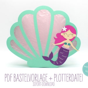May include: A printable mermaid craft template with a pink mermaid with a purple tail and a green seashell. The text "PDF Baste Vorlage + Plotterdatei" and "Sofort-Download" is included in the image.