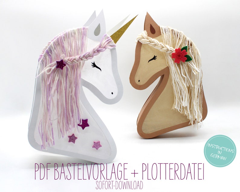 May include: Two papercraft unicorn heads, one white with pink yarn hair and the other brown with white yarn hair. The white unicorn has a gold horn and pink glitter stars. The brown unicorn has a red felt flower. The text "PDF Baste Vorlage + Plotterdatei" and "SOFORT-DOWNLOAD" is at the bottom of the image. A circle with the text "Instructions in German" is in the lower right corner.