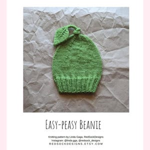 May include: A light green knitted beanie with a ribbed brim and a leaf-shaped topper. The text below reads: EASY-PEASY BEANIE, Knitting pattern by Linda Gaga, RedSockDesigns, Instagram: @linda.gga, @redsock_designs, REDSOCKDESIGNS.ETSY.COM.
