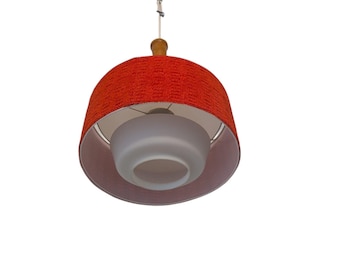 Vintage Mid-Century Modern pendant lamp with red textured fabric shade and white glass diffuser.