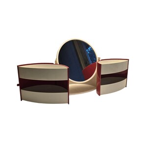 May include: A vintage vanity set with a round mirror and two side cabinets. The cabinets are white with red trim and have two shelves each. The mirror is white with a red base.