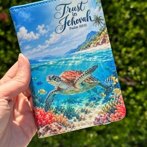 May include: A rectangular passport holder featuring a vibrant underwater scene with a sea turtle swimming above a coral reef. The sky above the ocean shows clouds and palm trees. The text Trust in Jehovah Psalm 115:11 is printed in black script.