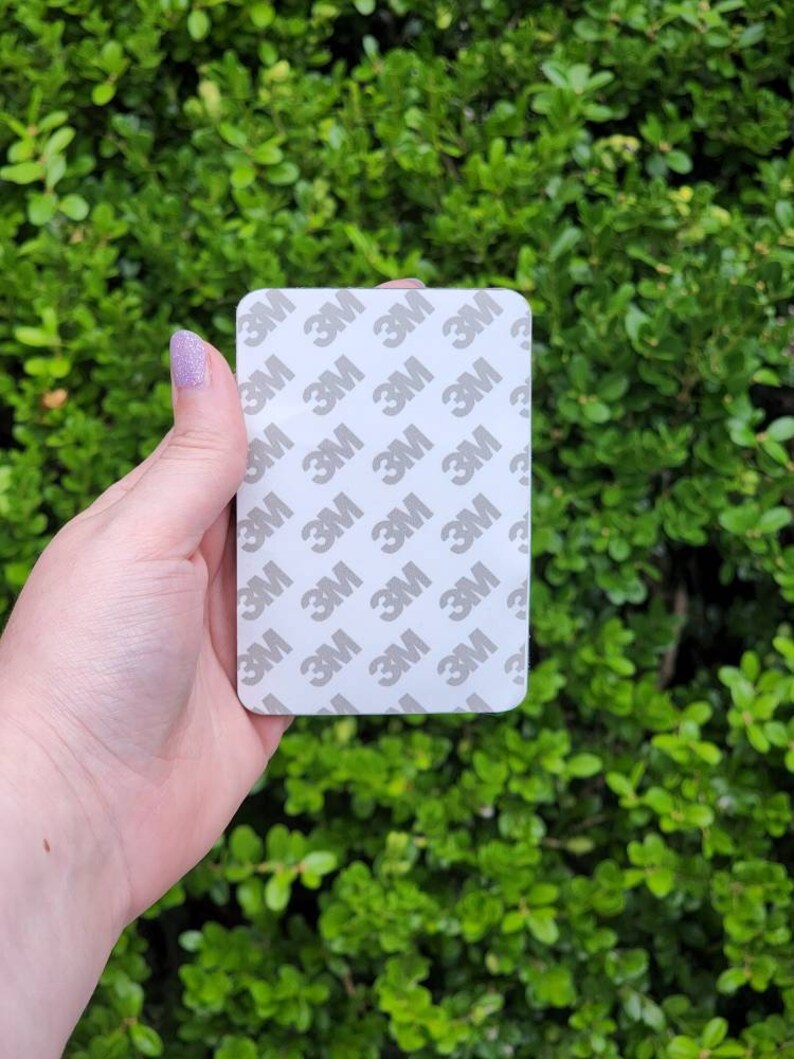 May include: A white rectangular sticker with the 3M logo repeated multiple times.