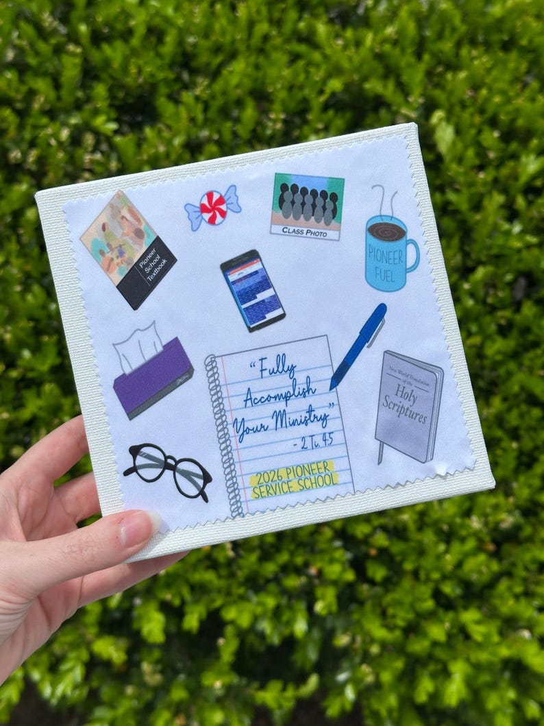 May include: A white canvas with various illustrated elements, including a textbook, candy, a phone, a coffee mug with "Pioneer Fuel", a notepad with the text "Fully Accomplish Your Ministry", glasses, and a book titled "Holy Scriptures".