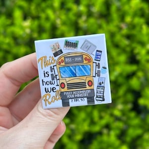 May include: Square magnet with a yellow school bus illustration. Text on the magnet reads "This is how we roll" and "Fully accomplish your ministry 2 Tim 4:5". The magnet also includes the text "PSS-2026".